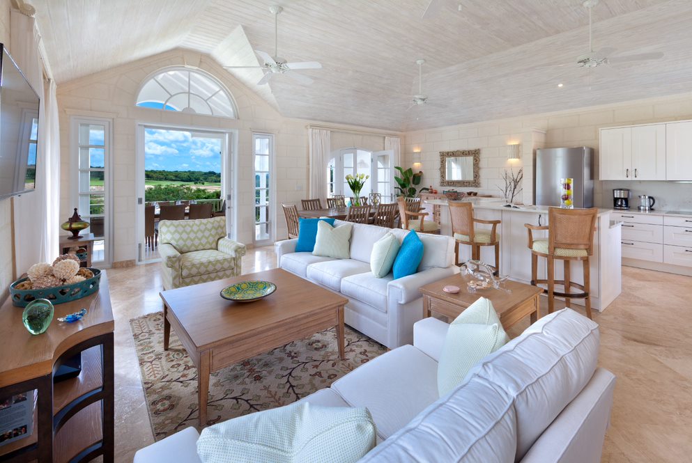 Interior Living and Dining Area: Spacious open-plan living and dining area with elegant decor, large windows that flood the space with natural light, and views of the Barbados landscape.