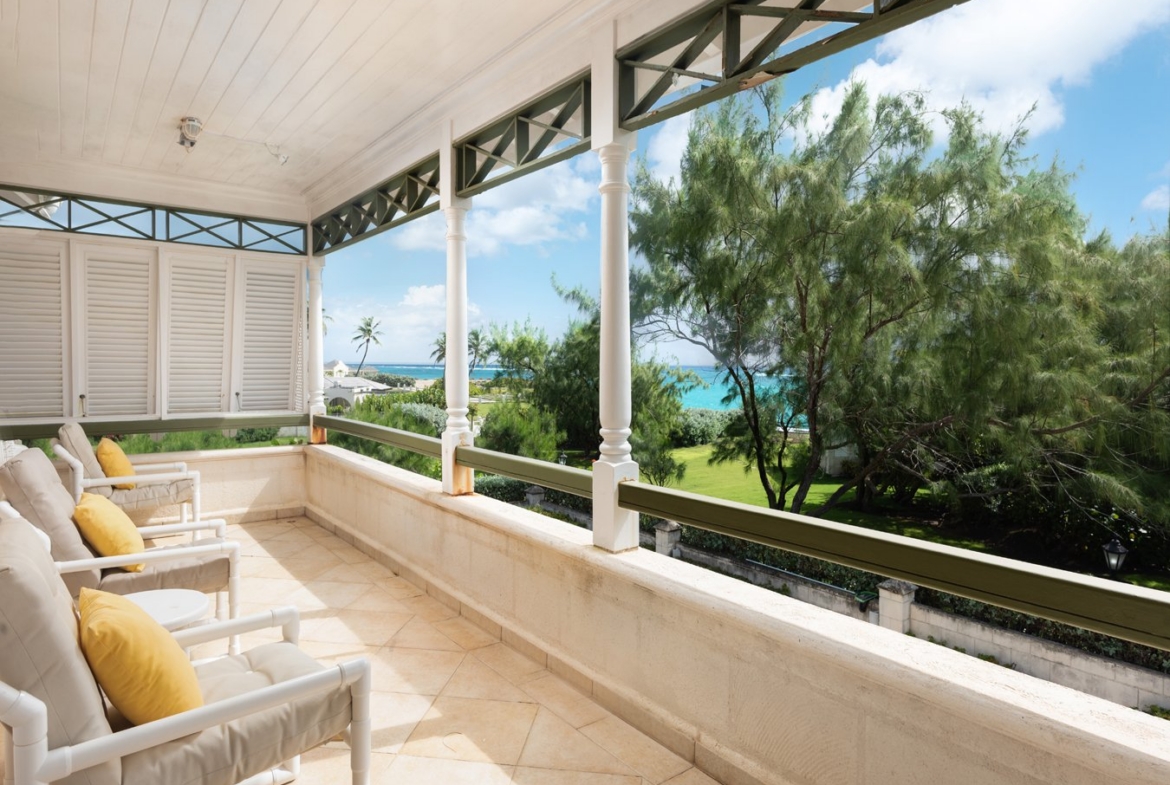 Covered terrace at Belle Rive Barbados overlooking tropical gardens