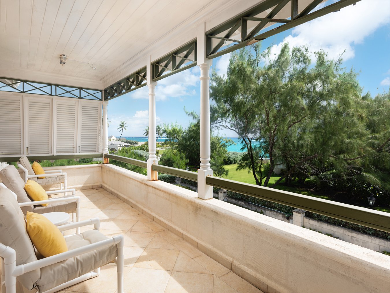 Covered terrace at Belle Rive Barbados overlooking tropical gardens